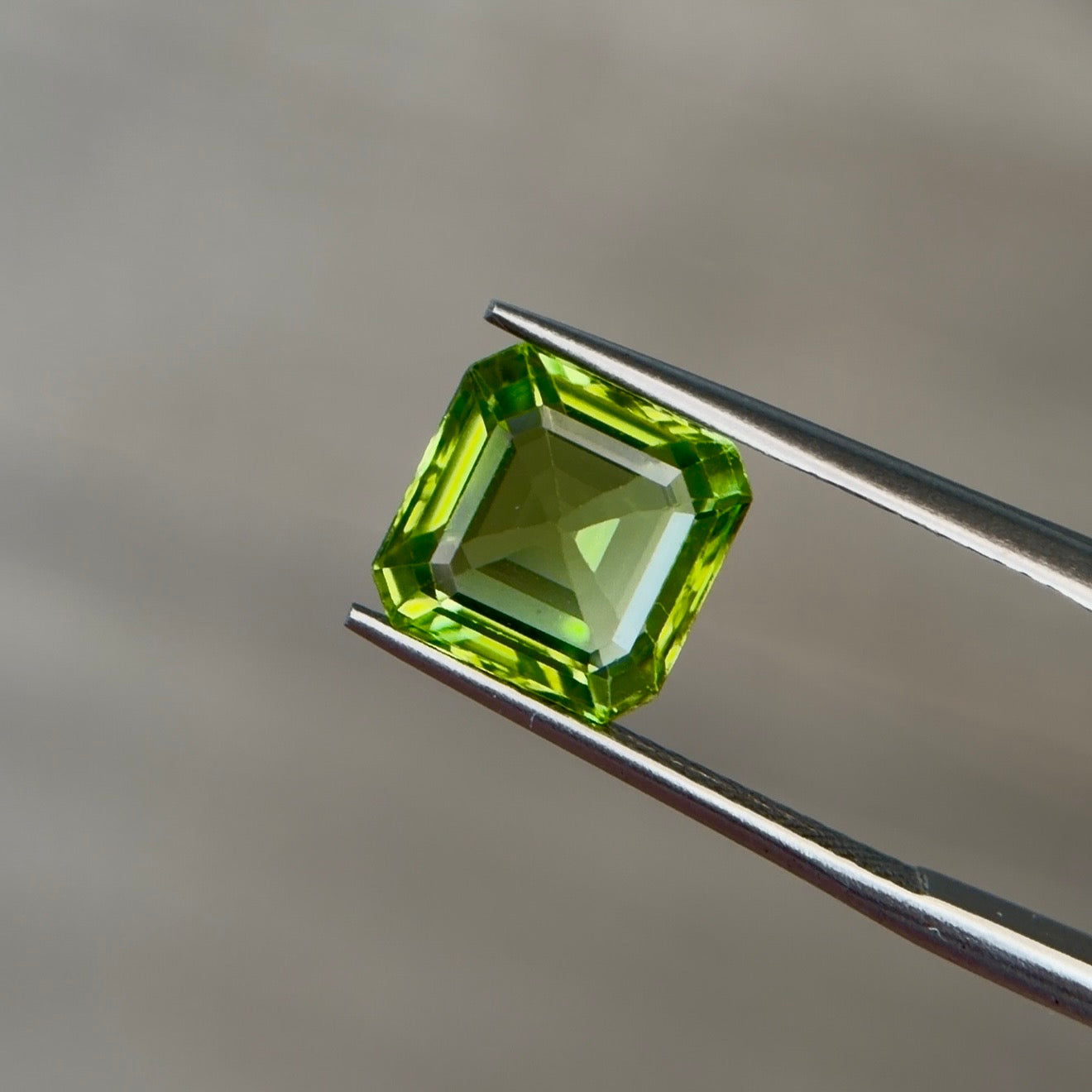 3.46 ct Natural Peridot Olive Green – Emerald Cut – AIG Certified