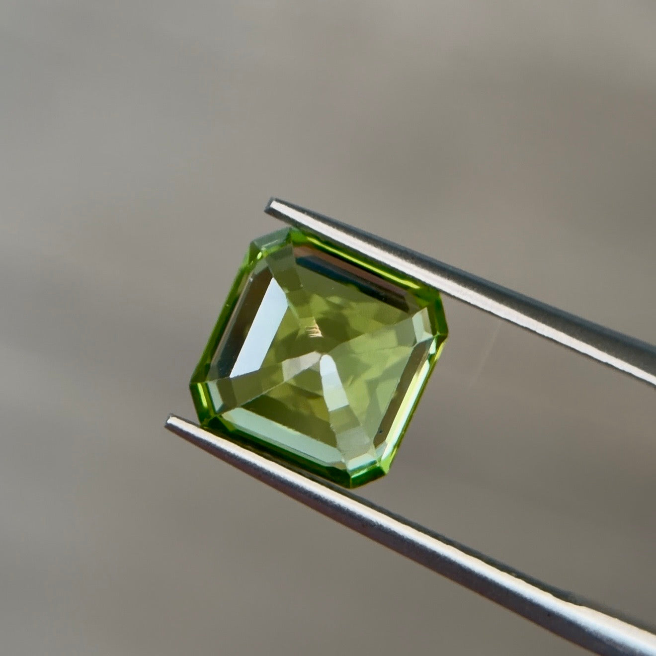 3.46 ct Natural Peridot Olive Green – Emerald Cut – AIG Certified