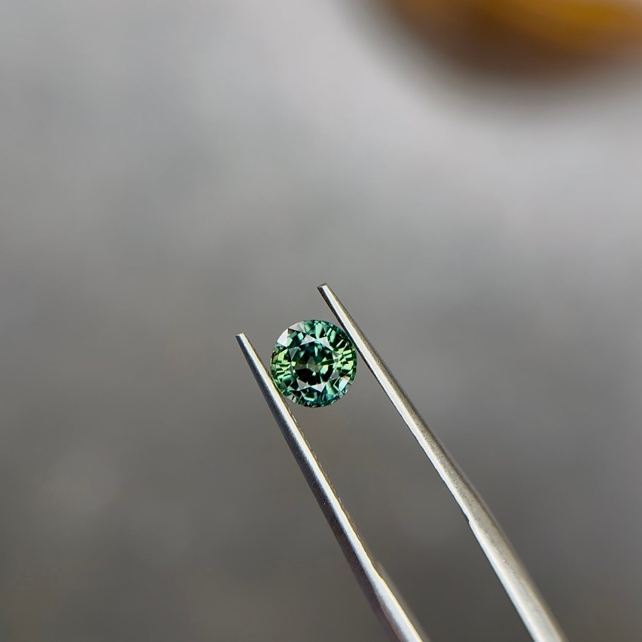 1.09 ct Natural Green Parti Sapphire (No Heat) – Round Cut – Tanzania – AIGS Certified